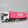 A pink container truck model with a white cab and black chassis, featuring details like wheels and lights.