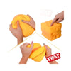 Hands are squeezing a bright yellow, soft, moldable stress relief toy.