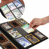 A hand is placing a sports card into a durable binder collection featuring various trading cards.