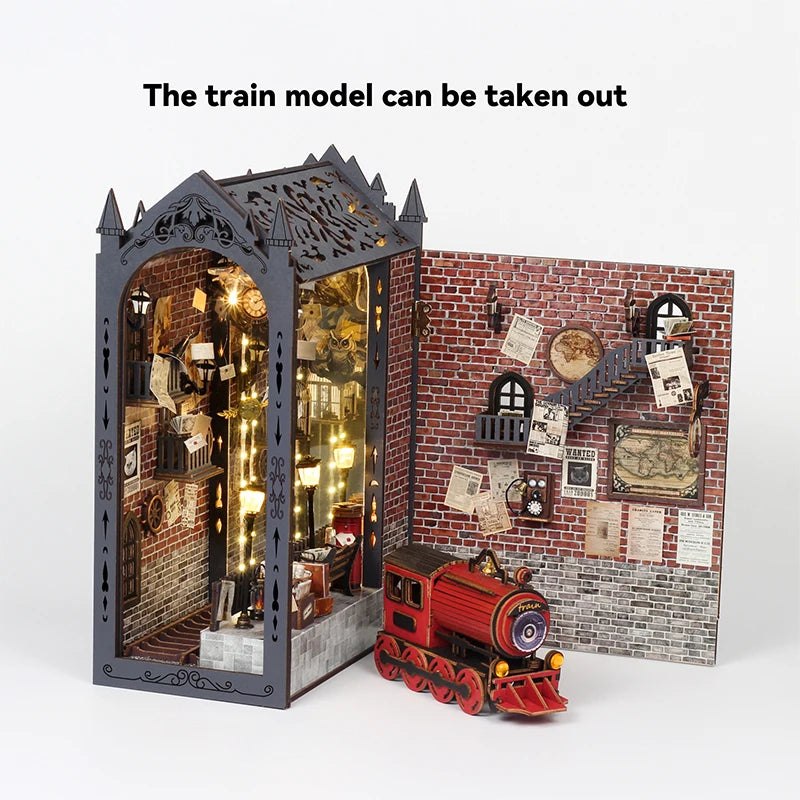 A wooden train model is placed in front of a detailed brick book nook display.