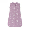 A sleeveless cotton baby sleeping bag sack in lilac purple with a pattern of white and light blue birds.