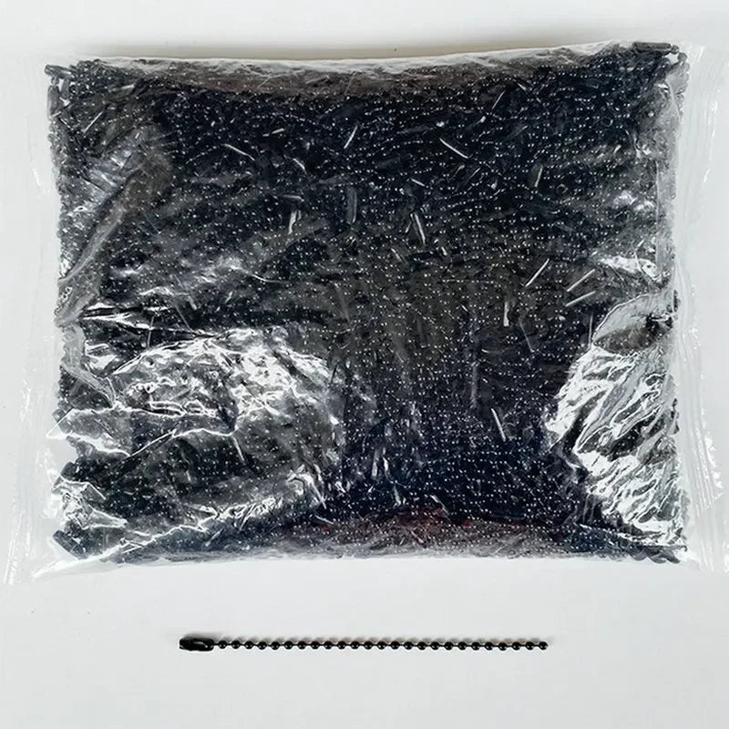 A clear plastic bag filled with black ball bead chains for DIY jewelry and keychains.
