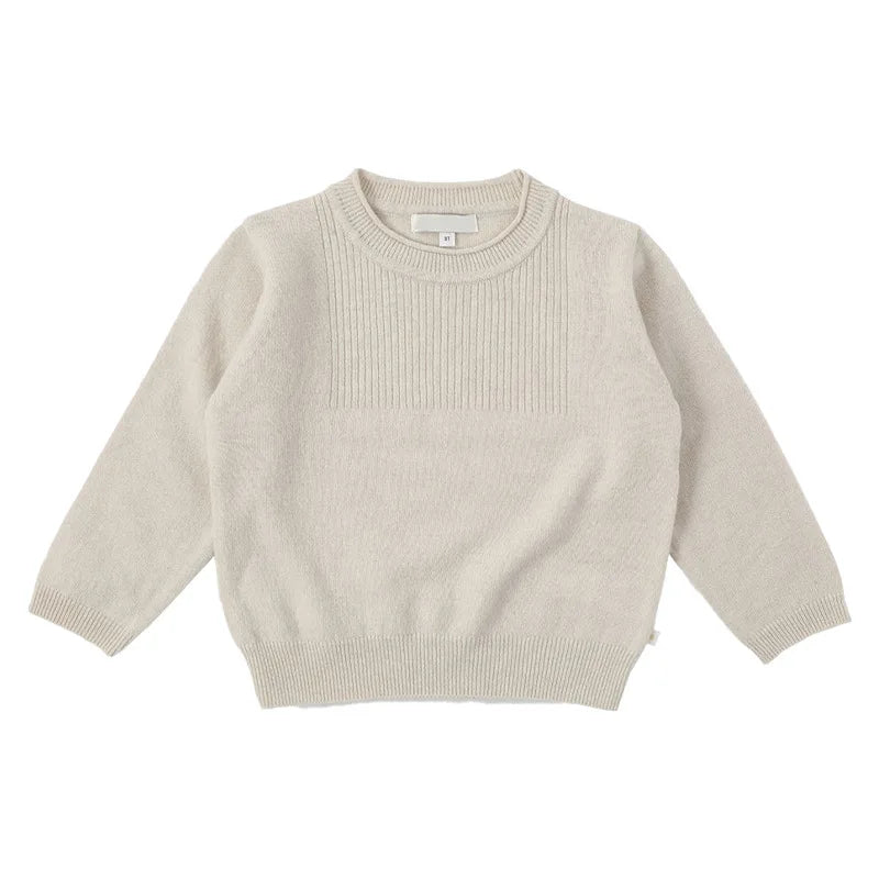 A light beige knit sweater and matching pants set for a toddler.