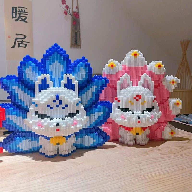 A set of nine-tailed fox figures made from blue and pink building blocks.