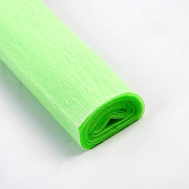 A roll of bright lime green crepe paper for DIY crafts and gift wrapping.