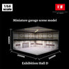 A miniature garage scene model of an exhibition hall with a roof and display area.