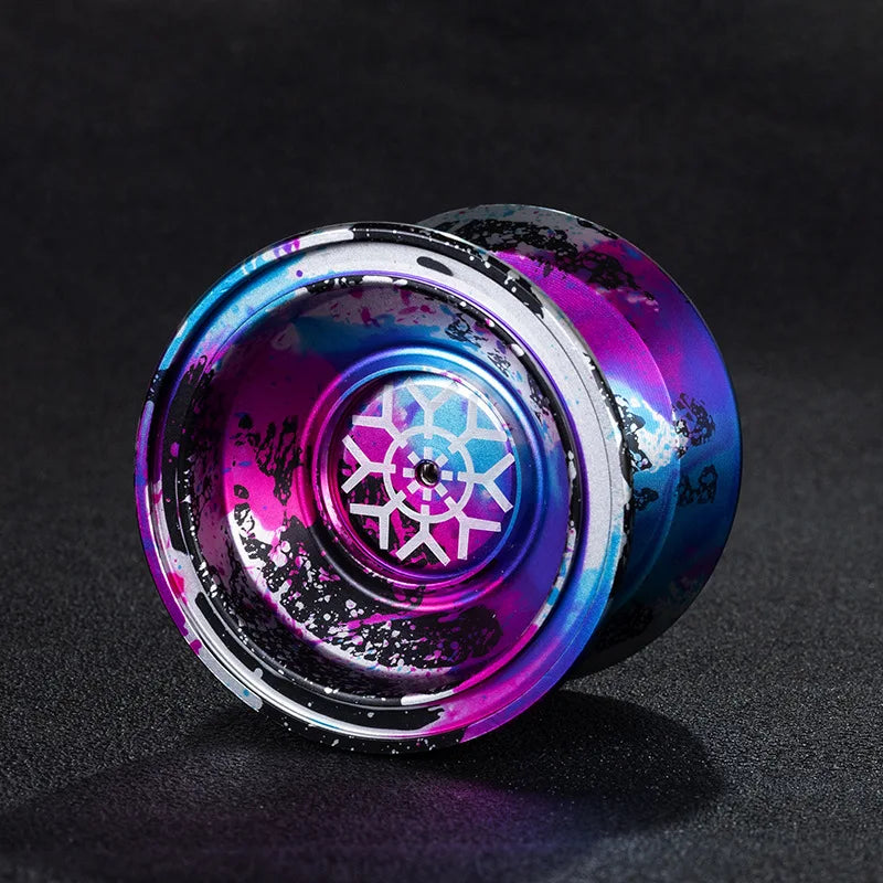 A close-up of a professional aluminum alloy yo-yo with high-speed ball bearings, featuring iridescent purple and blue finishe