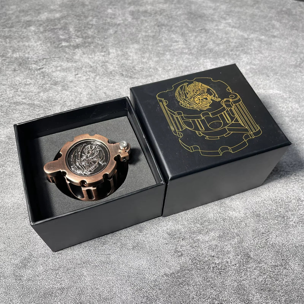 A black box containing a revolver-shaped metal dice set for RPG games with a gold line drawing on the lid.