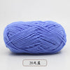 A ball of light blue pre-dyed milk cotton yarn used for knitting and crochet.