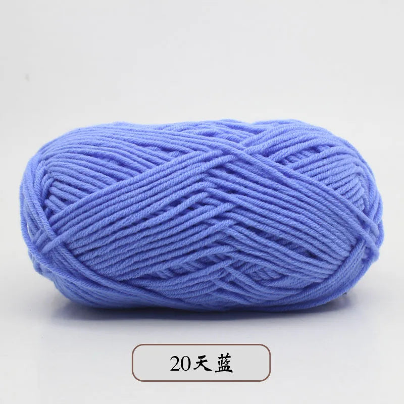 A ball of light blue pre-dyed milk cotton yarn used for knitting and crochet.