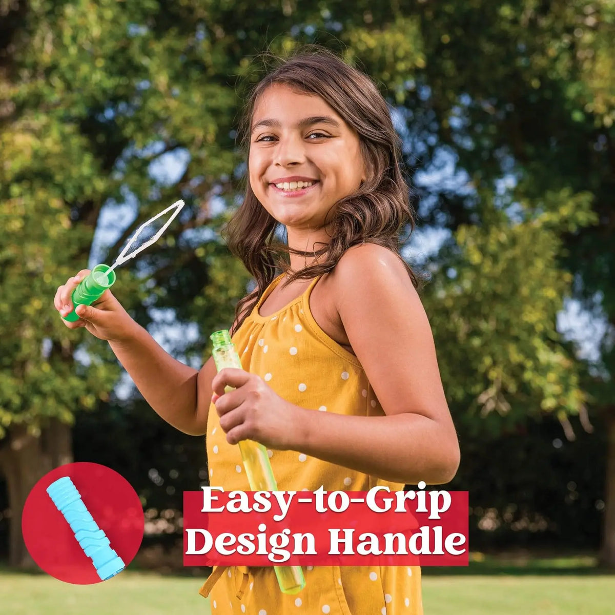 A smiling girl holds a green bubble wand, ready for outdoor fun.
