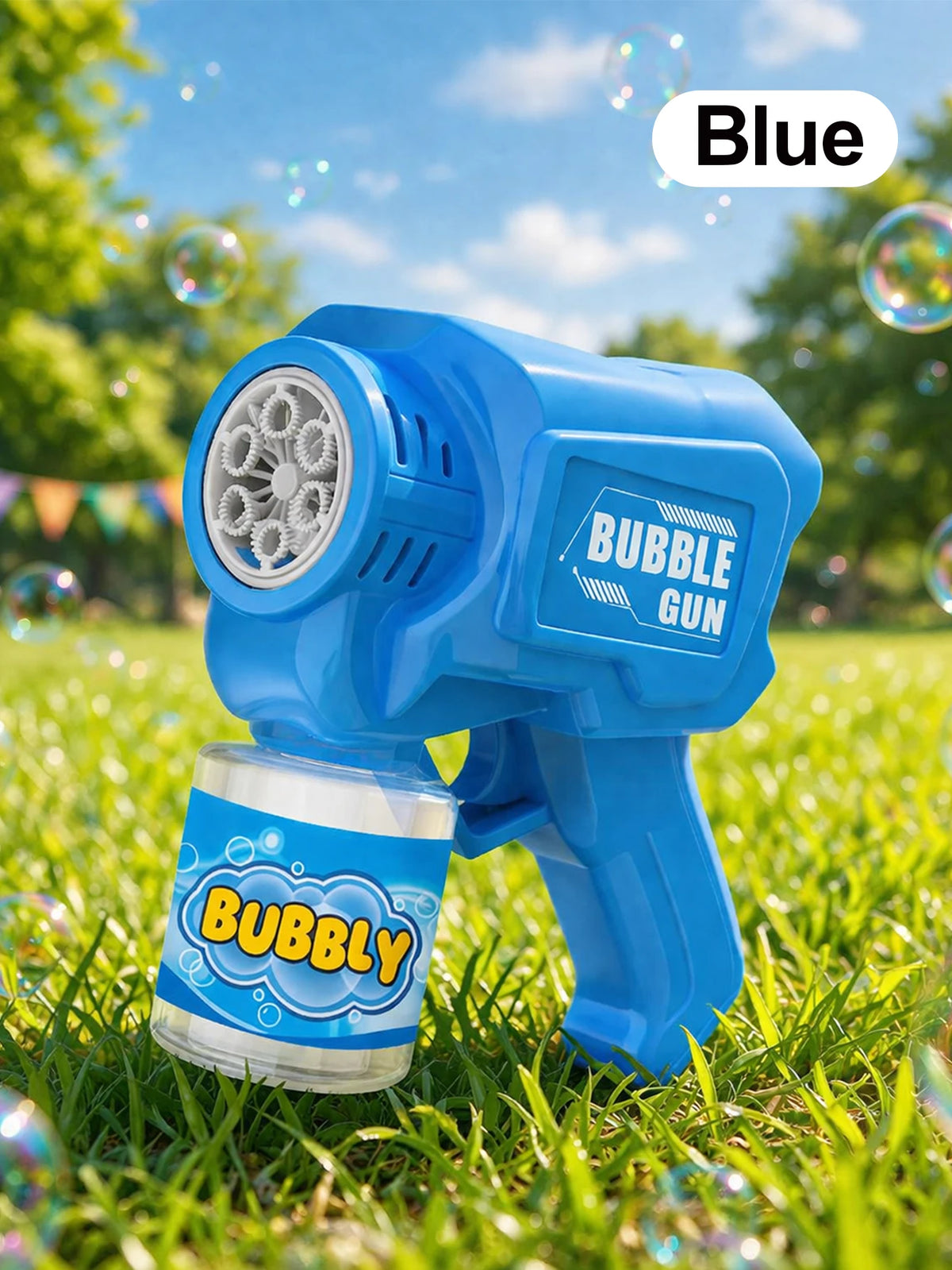 A blue bubble gun is shown outdoors on green grass with bubbles floating in the air.