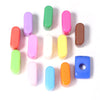 A collection of colorful, elongated acrylic alphabet beads in various shades including pink, green, purple, orange, and brown