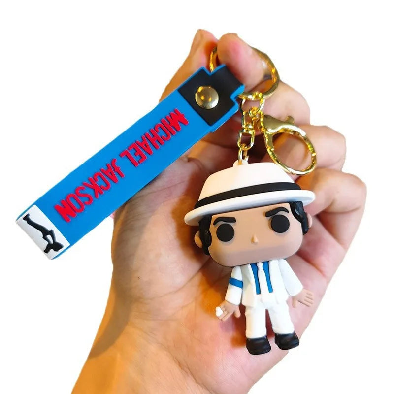A silicone keychain featuring a figure of Michael Jackson with a metal clip attached.