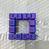 A purple infinity cube fidget toy made of interlocking plastic blocks.