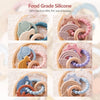 Assortment of food grade silicone teether rings in various colors and shapes for babies
