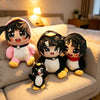 A collection of cute penguin plush toys with black and white features sitting on a light-colored sofa.