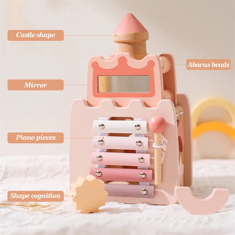 A pink wooden stacking toy shaped like a castle, featuring mirror, piano pieces, and abacus beads for shape cognition.