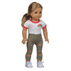 A doll wearing a white shirt with a rainbow trim and olive green pants with ripped details.
