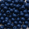 A pile of small, dark blue wooden beads for jewelry making and DIY crafts.