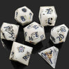 A set of milk white resin dice featuring a black kitten design, shown from various angles.
