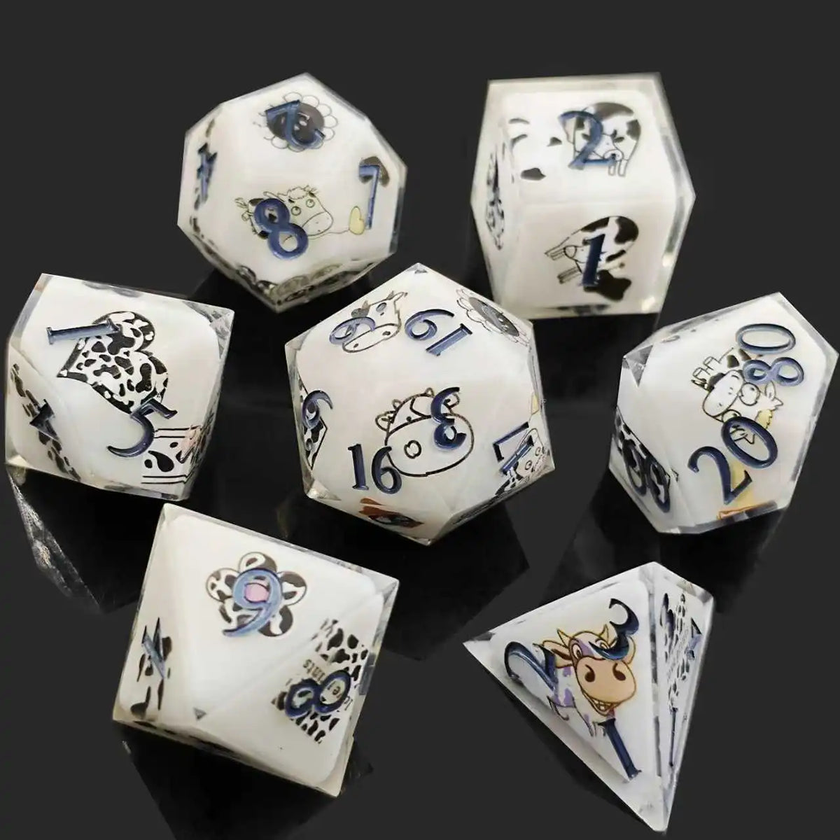 A set of milk white resin dice featuring a black kitten design, shown from various angles.