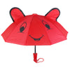 A red umbrella shaped like a bear face with black eyes and a smiling mouth.