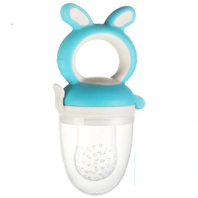 A light blue silicone baby food feeder with a rounded top and a clear, perforated bowl.