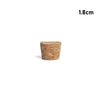 A small, cylindrical piece of natural wood used as a tapered bottle and test tube stopper.