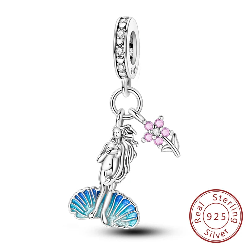 Sterling silver charm beads set featuring cross, angel, and evil eye designs for DIY jewelry making