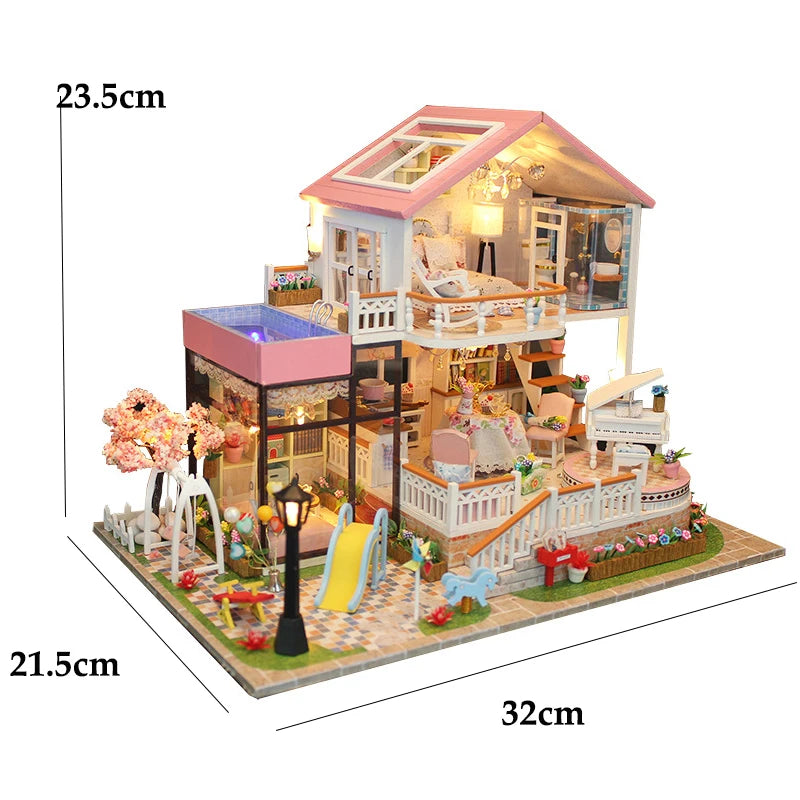 A detailed miniature dollhouse kit of a seaside beach house with multiple levels and an LED light feature.