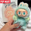 A soft green plush doll of Labubu 3.0 Big Into Energy collectible, featuring large eyes and a toothy grin.