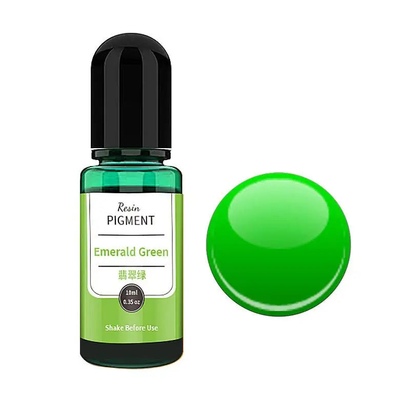 A small glass bottle of Emerald Green resin pigment with a black cap and a green spherical bead.