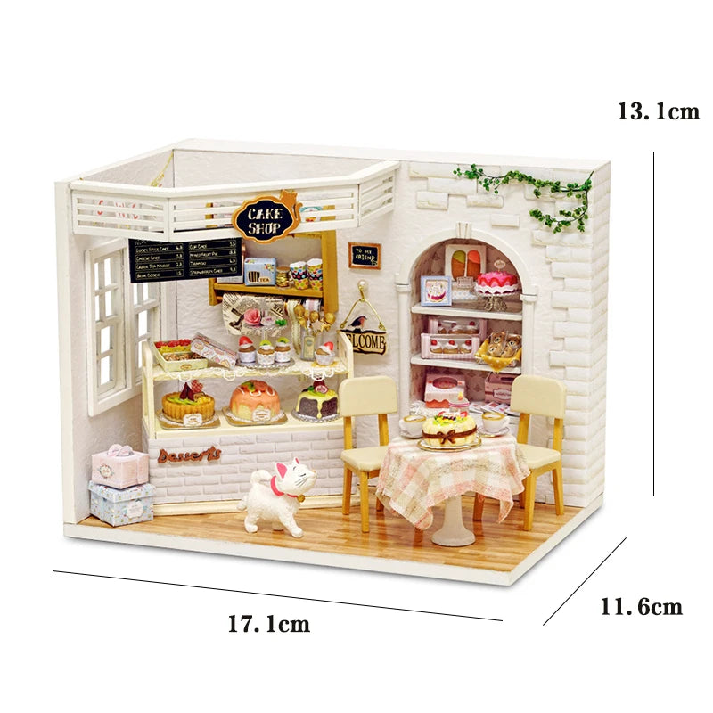 A miniature dollhouse kit featuring a cafe setting with furniture and decorative elements.