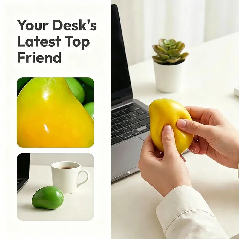 A hand holds a yellow mango-shaped squishy stress ball next to a laptop on a white desk.