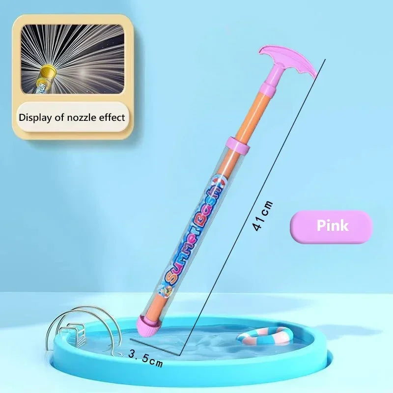 A pink water blaster toy gun with a purple handle is shown aiming into a blue pool.