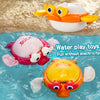 A set of wind-up swimming bath toys featuring pink and yellow duck animals floating in blue water.