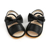 Pair of black baby summer sandals with a bowknot and soft anti-slip sole