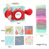 A soft fabric tissue box sensory toy featuring a crab design with various colored fabric inserts and number cards.