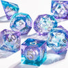 A collection of handmade liquid core polyhedral dice in shades of blue and purple with a galaxy finish