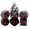 A set of seven polyhedral dice featuring Roman numerals and a marbled black and gray finish.