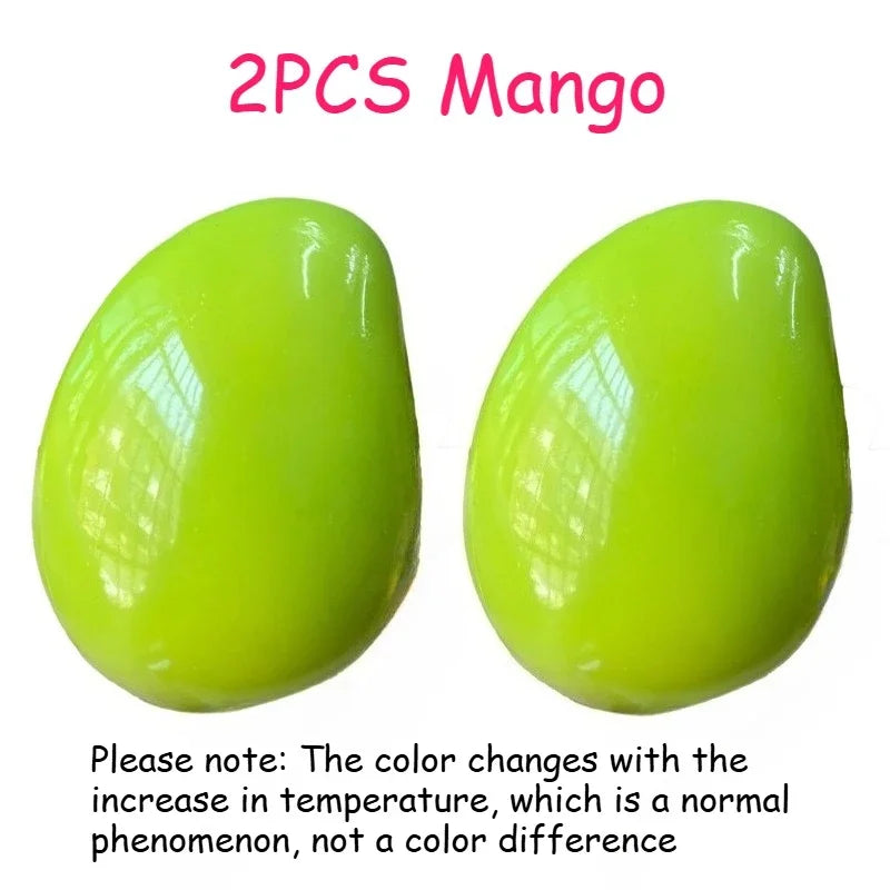 Two bright lime green stress balls showing color change with temperature