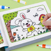 A hand is coloring a cartoon rabbit in a children's coloring book featuring a tree and grass.