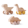 Three wooden dinosaur toy cars for baby teething