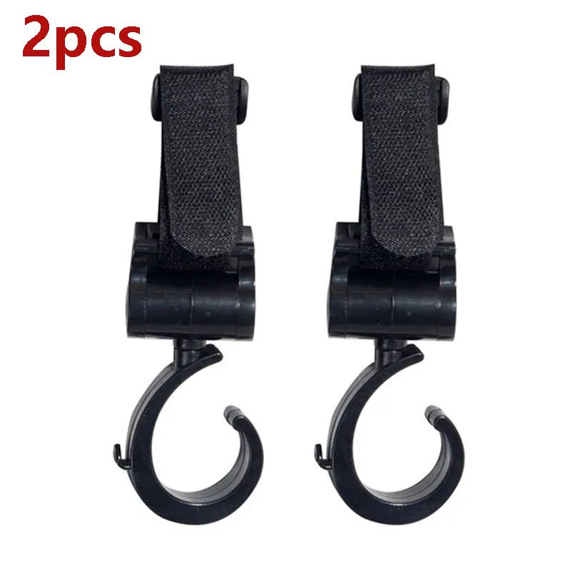 A pair of black universal multi-purpose stroller hooks for shopping and baby bags