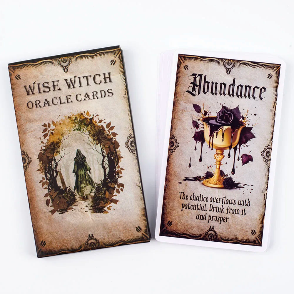 A deck of Wise Witch Oracle Cards featuring an abundance card with a golden chalice and dark purple liquid.