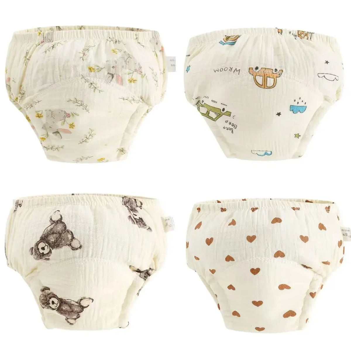 A set of reusable cotton potty training pants for toddlers in off-white with floral and animal patterns.