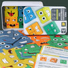 A box of wooden face-changing puzzle cubes and several loose game pieces showing various facial expressions.