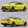 A bright yellow 1:32 scale diecast model of a BMW M4 or X3M sports car.