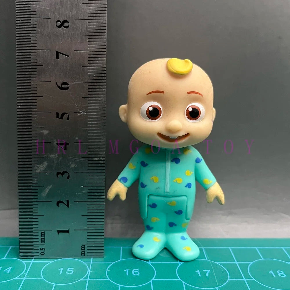 A cheerful cartoon figurine of a child wearing a blue and yellow polka-dot school uniform.